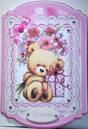 Cute teddy with gift and flowers in flower bracket card by Hazel Underwood