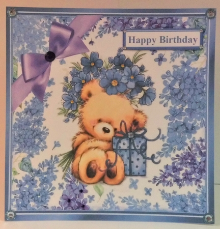 Cute teddy with gift and blue flowers in flower 8x8 frame by Hazel Underwood