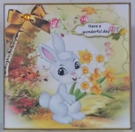Cute Bunny carrying Daffodils with gold bow 7x7 by Hazel Underwood