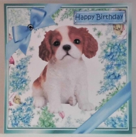 lovely little cavalier puppy (seven) with blue bows  and flowers 8x8 by Hazel Underwood