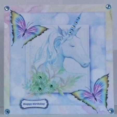 blue rainbow unicorn with butterflies 8x8 by Hazel Underwood