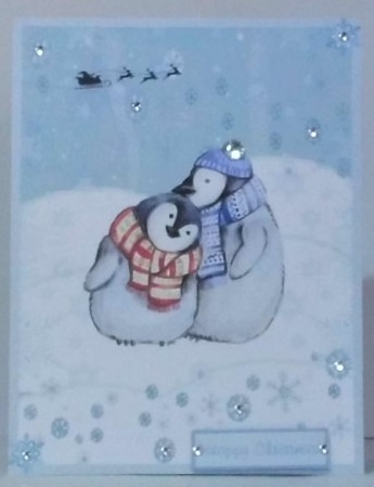 Christmas greeting card with cute Penguins by Hazel Underwood