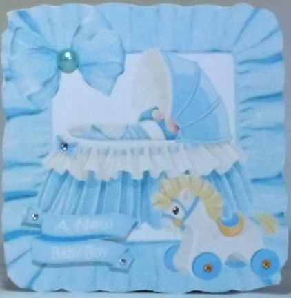 Basinette with baby boy in blue frill frame with bows 8x8 by Hazel Underwood