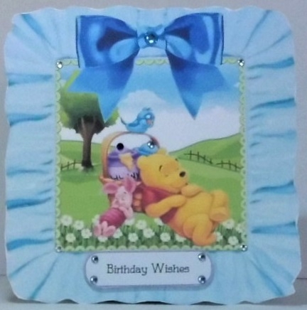 Snoozy bear and friends in frill frame 8x8 with blue bow by Hazel Underwood