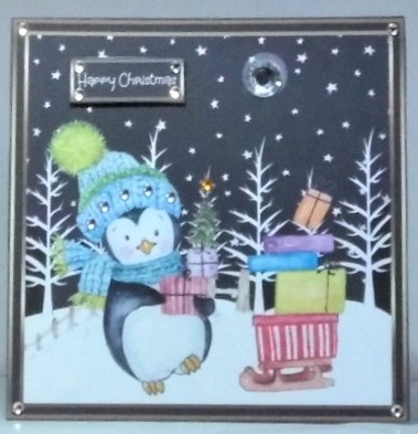 Penguin stacking the presents by Hazel Underwood