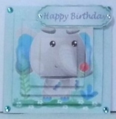 Cute painted  elephant with flowers and bird  with  bow pyramids by Hazel Underwood