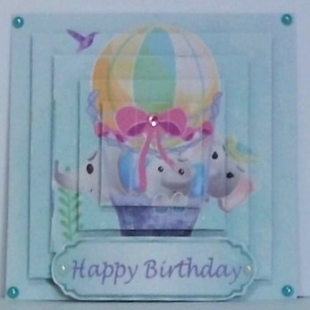 Cute painted  elephants fun in a ballon and ornate corners pyramids by Hazel Underwood