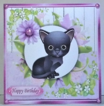 Cute black kitten with pretty lilac flowers, wooden back ground 8x8 by Hazel Underwood