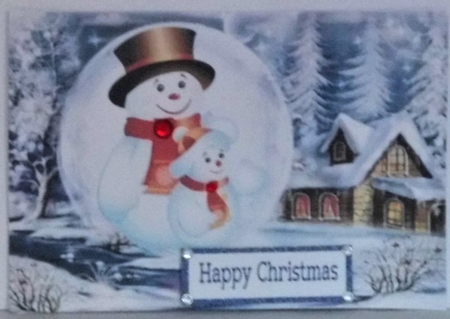 Lovely snow scene with snowman in snowball with holly A5 by Hazel Underwood