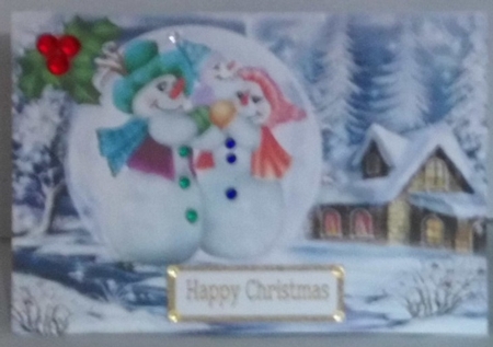  Lovely snow scene with snowman family in a snowball with holly A5,  by Hazel Underwood