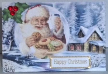 Lovely scene with santa and his milk & cookies in snowball with holly A5 by Hazel Underwood