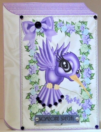 Pretty toon purple humming bird with flowers and bow folded book by Hazel Underwood