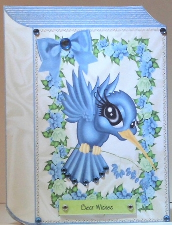 Pretty toon blue humming bird with flowers and bow folded book by Hazel Underwood
