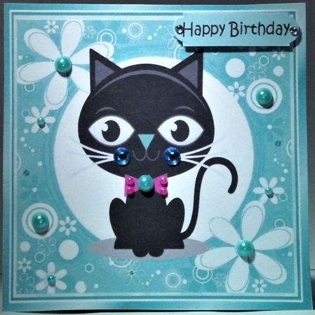 Cartoon black cat in funky turq flower frame 7x7 by Hazel Underwood