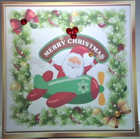 santa in a plane in holly frame with bows 8x8 by Hazel Underwood
