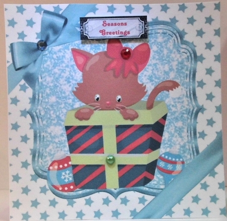 Cute kitten in christmas gift with bow and turq stars 8x8 by Hazel Underwood