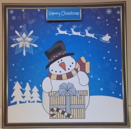 A snowman with a gift by Hazel Underwood