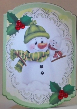 snowman in bobble hat with holly on lace bracket card by Hazel Underwood