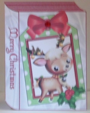 Cute Reindeer with holly on a folded book with holly by Hazel Underwood