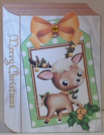 Cute Reindeer with holly on a gold folded book with holly by Hazel Underwood
