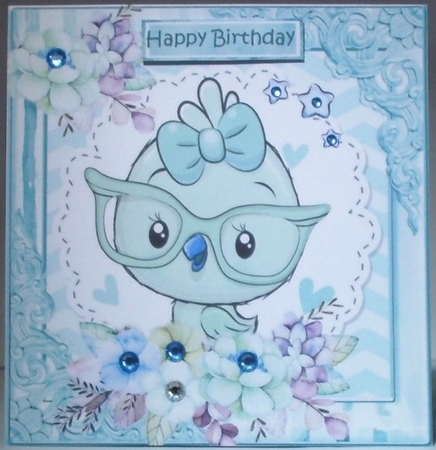 Little turq bird with flowers in ornate 8x8 frame by Hazel Underwood