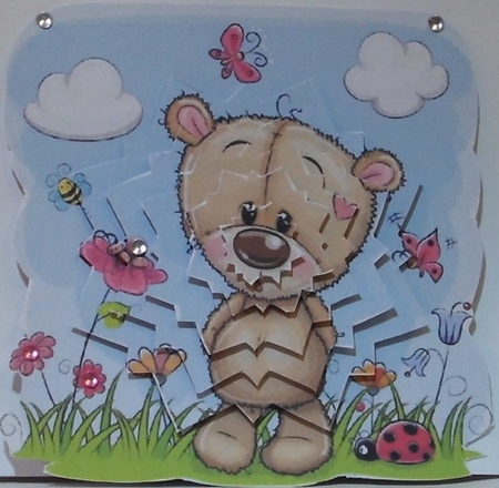 Cute teddy in flower garden snow flake pyramids by Hazel Underwood