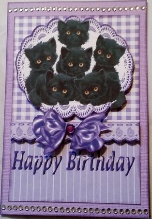 Six Cute Little Black Kittens on Lace with Purple Bow by Heather Beechey