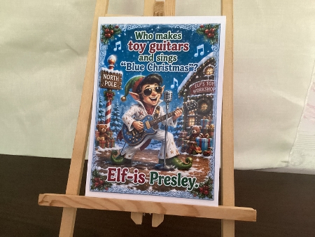 who makes toy guitars and sings blue christmas? by Heather Howes