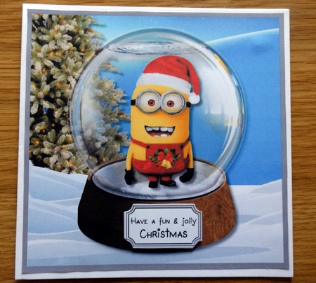 Minion Christmas Snow Globe by Helen Gomm