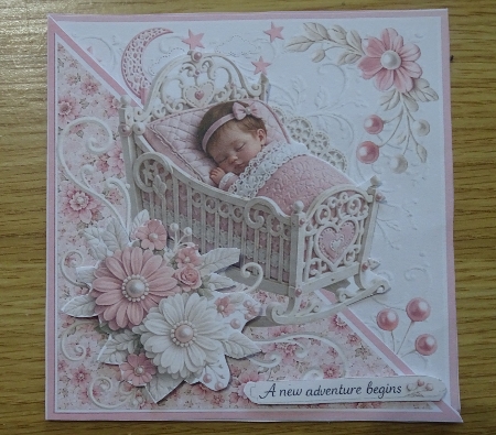 Sleeping Baby Girl in Pink Cradle Floral Embossed Card Front by Helen Gomm
