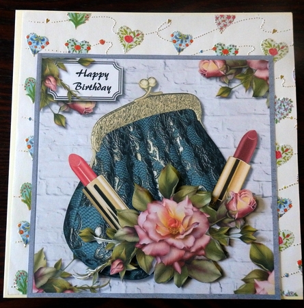 Evening bag with roses and lipstick by Helen Gomm