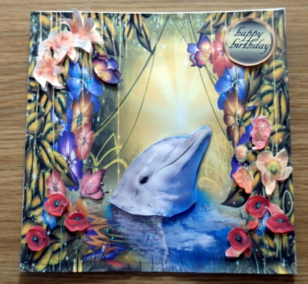 dolphin in the flowers  by Helen Gomm