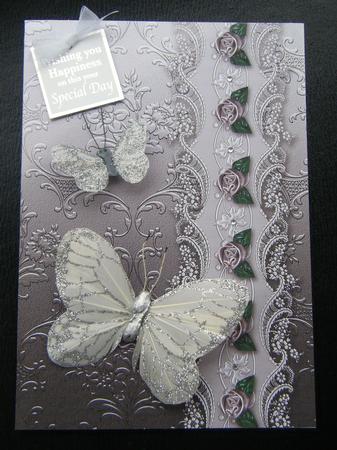 Chocolate Floral Spray Embossed with Floral Border by Charlie Angel