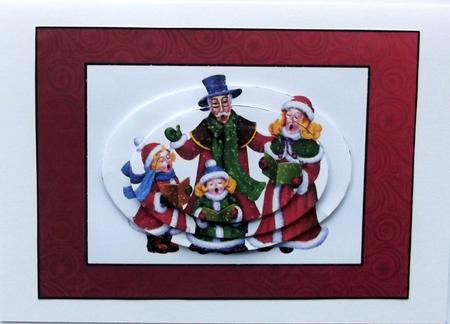 Christmas Carolers Oval Pyramid by Hilary Shemmans