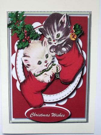 Kittys Hanging in the Christmas Stockings  by Hilary Shemmans
