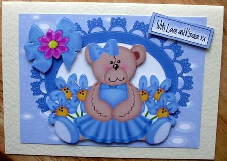 Little Bear in Blue Dress with Flowers by Hilary Shemmans