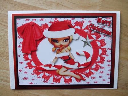 Little Lady in Santa Suit on Candy Cane by Hilary Shemmans
