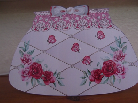 A clutch handbag with bow by Hilda Mullinger