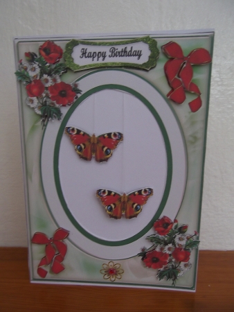 OVAL FRAME FEMALE DINGLE DANGLE by Hilda Mullinger