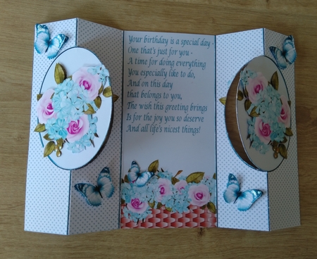 Pretty pink turq flowers with butterflies cut out by Honorscard Appleby