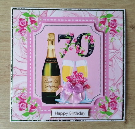 Age 70 rose and champagne card front by Honorscard Appleby