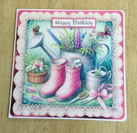 wellies and watering can on lace by Honorscard Appleby