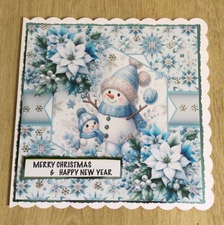 blue poinsettias snowman by Honorscard Appleby