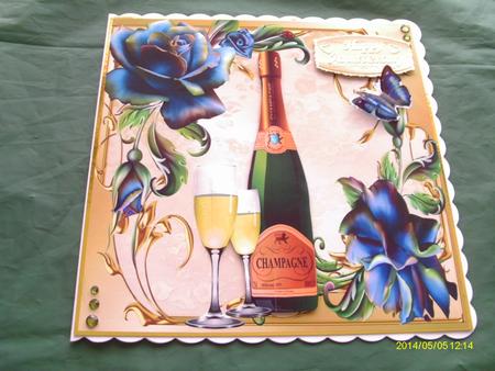 Champagne and Glasses with Beautiful Blue Roses  by Honorscard Appleby