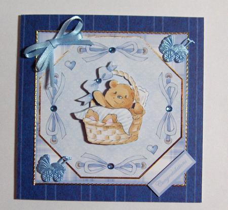 Baby Boy Bear in a Basket Card Front by Jayne Jones