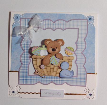 Baby Boy Bear in a Basket Card Front by Jayne Jones