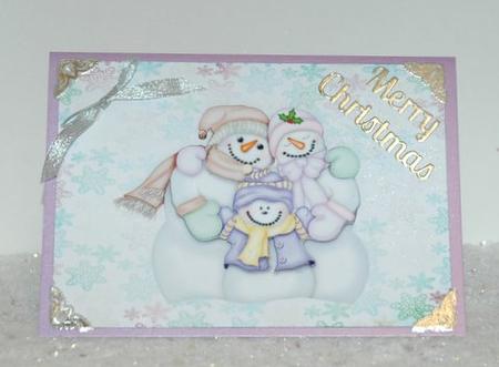 Cute Snowman Family on Pretty Snowflake Backing Paper by Jackie Bullock