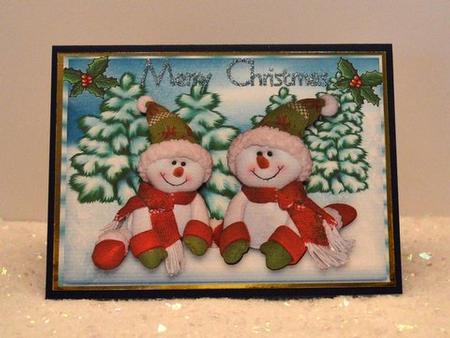 Cute Snowmen Sitting in the Snow  by Jackie Bullock