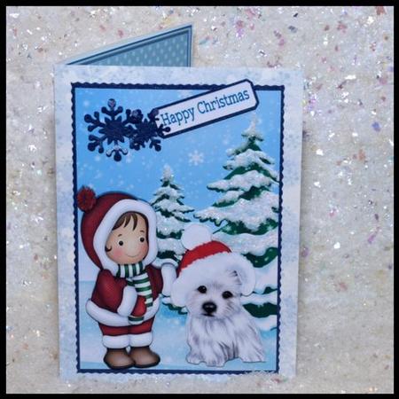 Small Child with Westie in Santa Hat in the Snow by Jackie Bullock