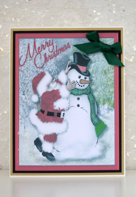 Santa Putting on the Snowman's Hat  by Jackie Bullock